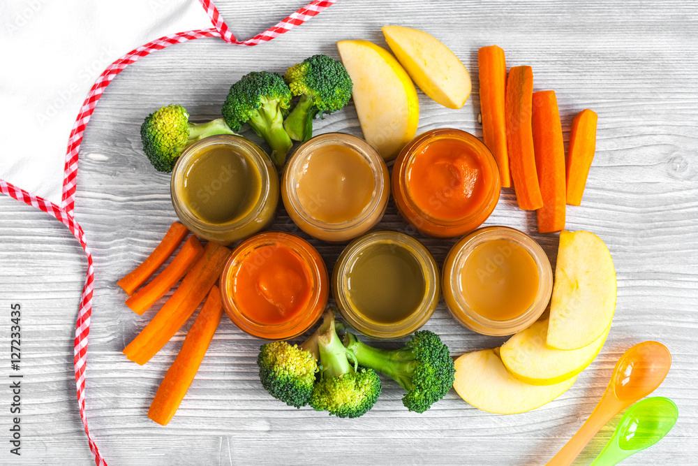 baby vegetable puree on wooden background top view