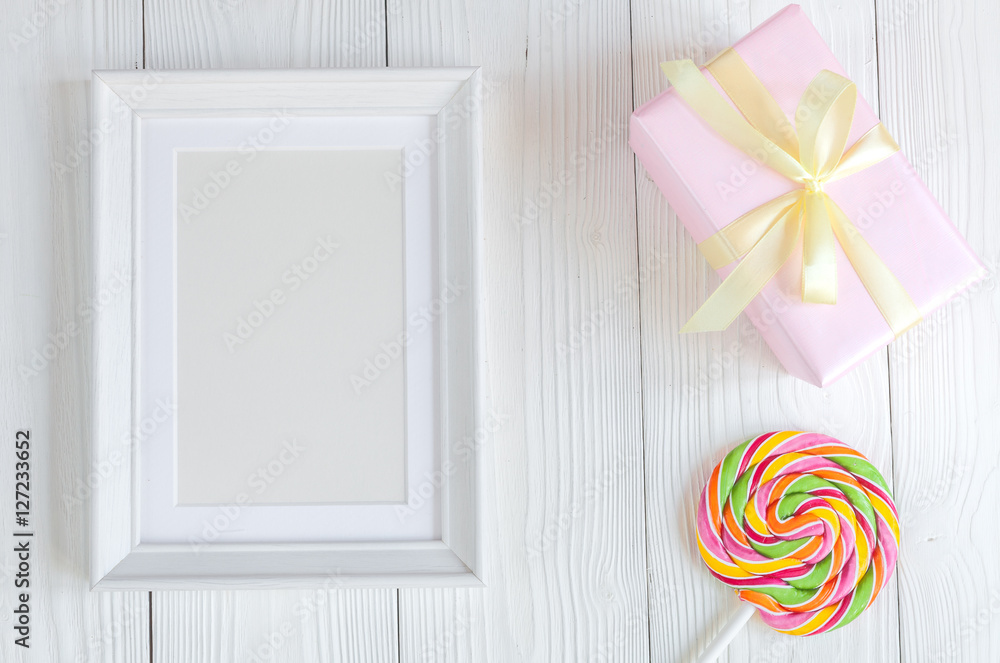 birth of child - blank picture frame on wooden background