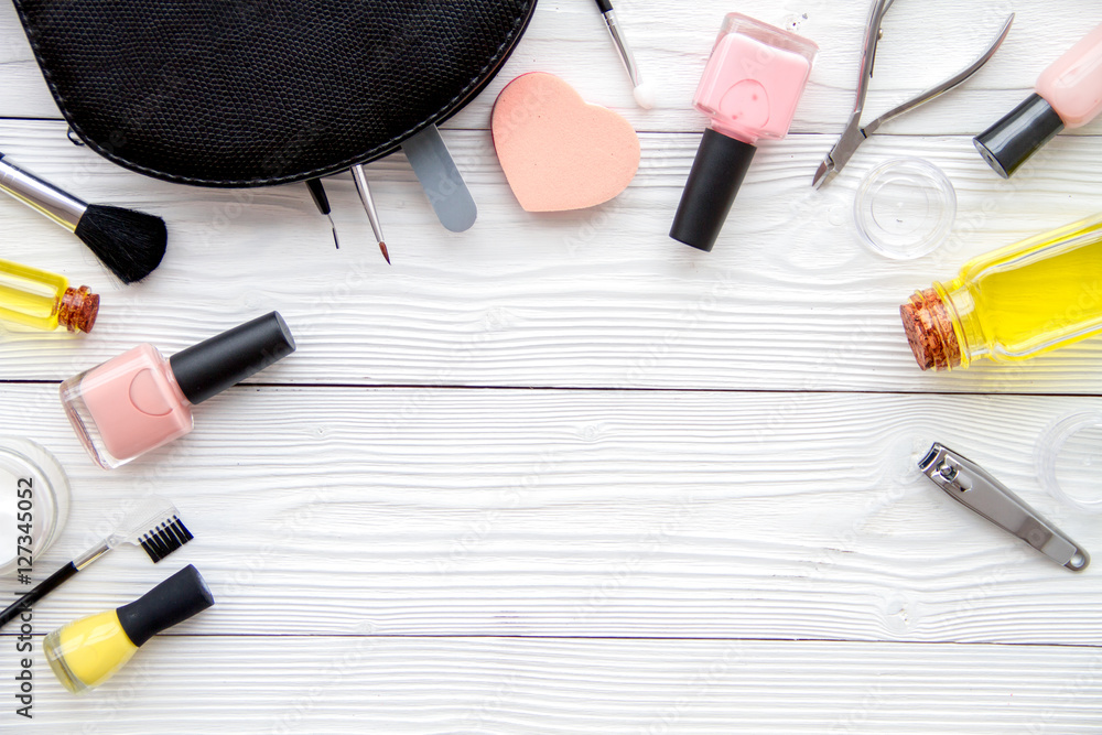 set for manicure and make-up on wooden background