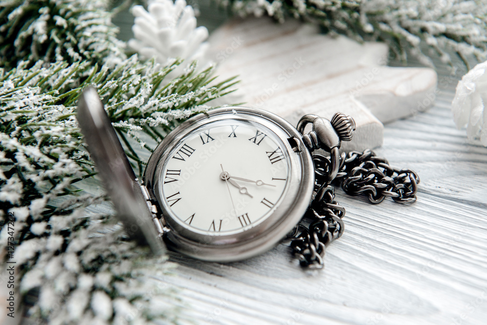 new year on wooden background with watch close up