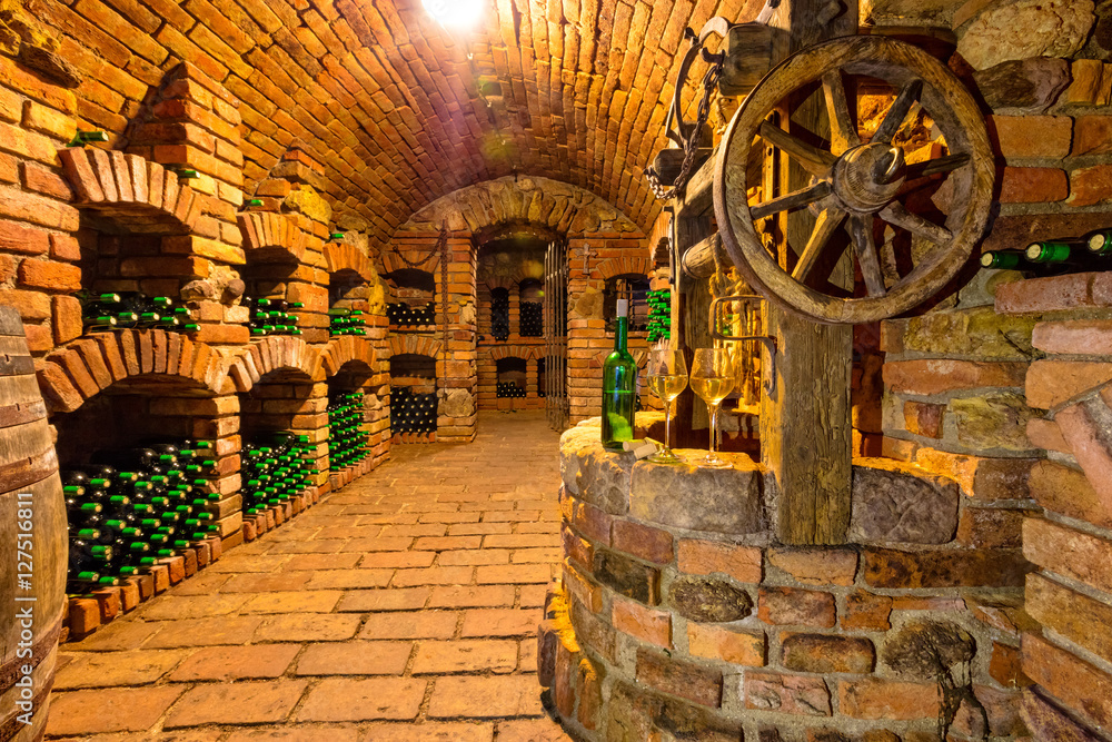 Small wine cellar with bottle and glasses of wine