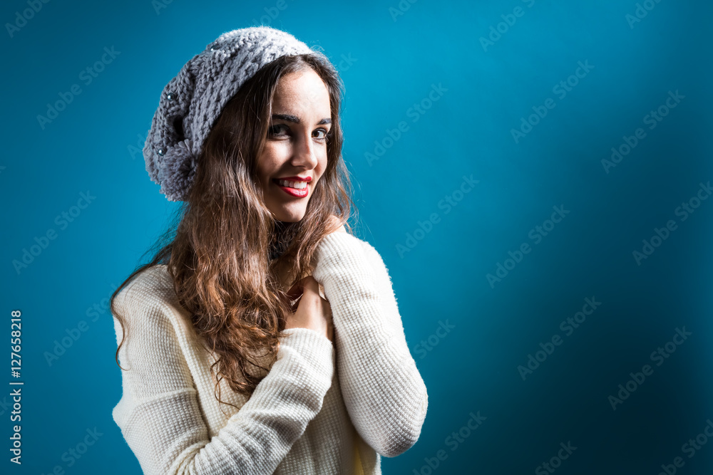 Happy young woman in winter clothes