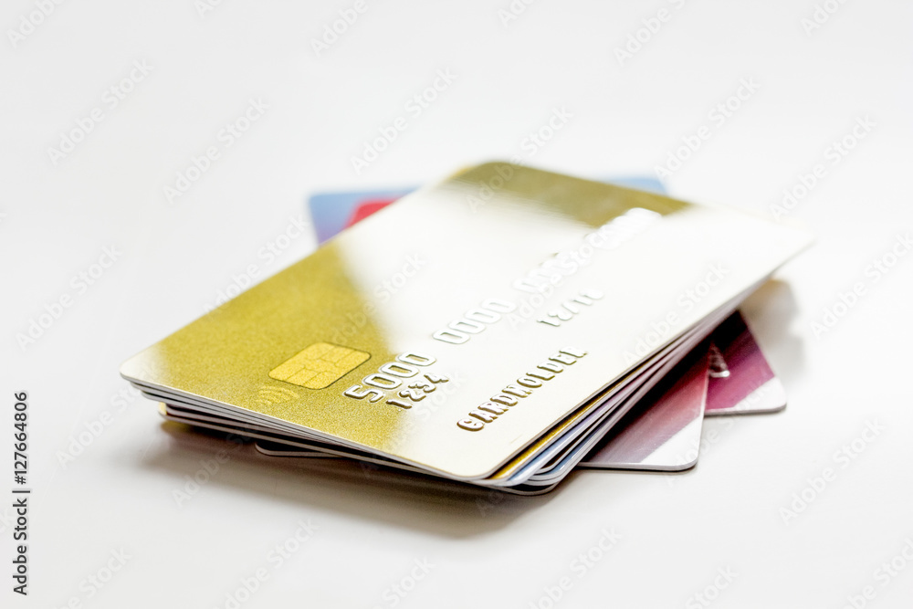 pile of credit cards on white background