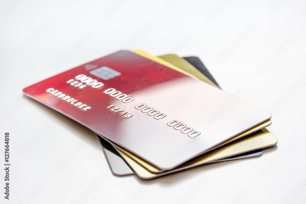 pile of credit cards on white background