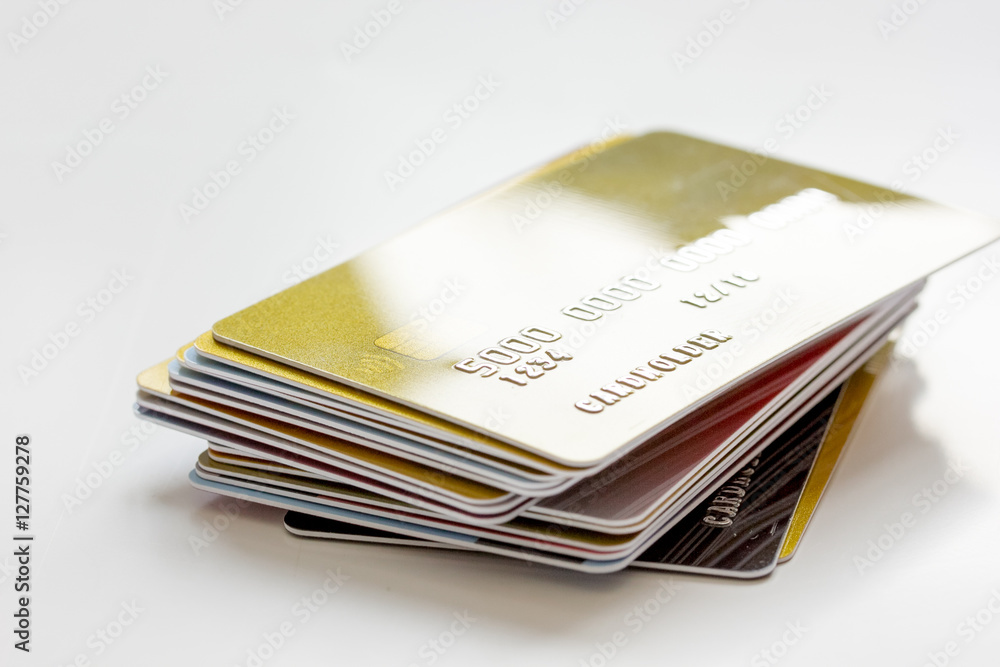 pile of credit cards on white background