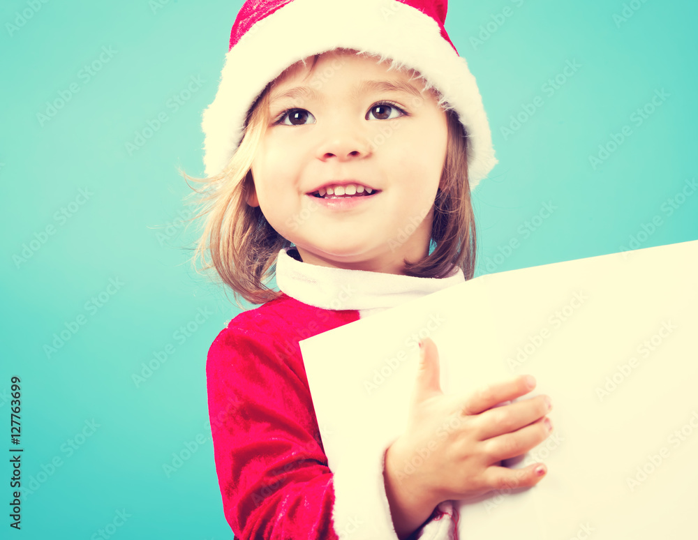 Happy toddler girl with Christmas gift box