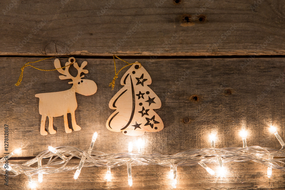 Vintage Christmas decoration and lights on the wooden background