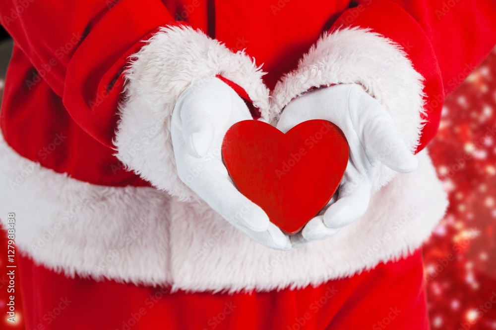 Composite image of santa claus showing red heart shape