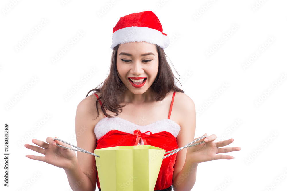 Portrait of a young smiling woman holding and looking into shopp