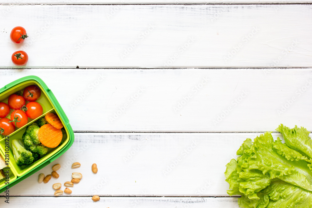 preparing lunch for child school top view on wooden background