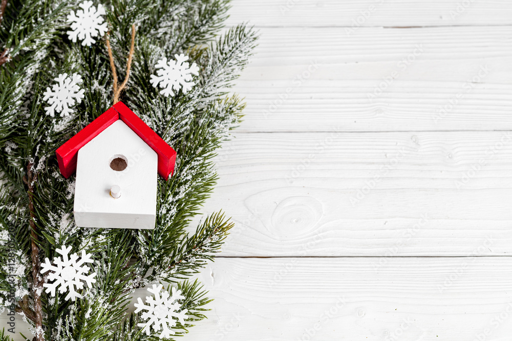 Christmas toys and spruce branches on wooden background top view