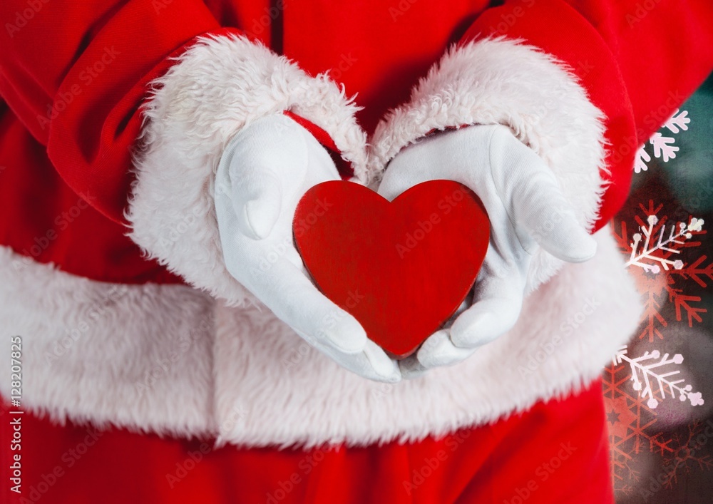 Santa hand holding a heart