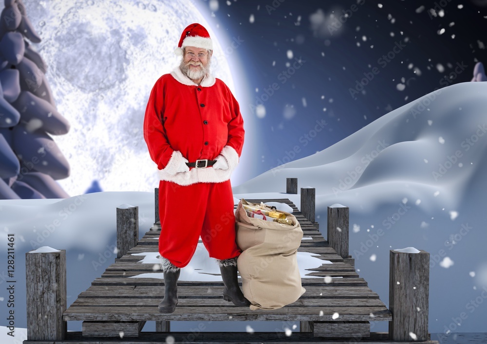 Santa claus with gift sack standing on a pier