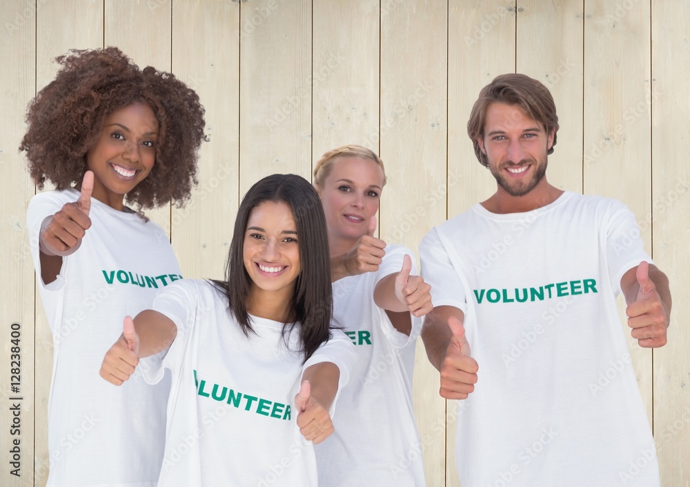 Group of volunteers showing thumbs up