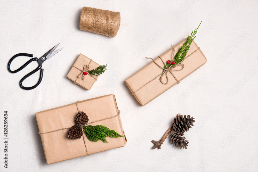 Christmas presents. Packages wrapped in kraft paper tied with ju