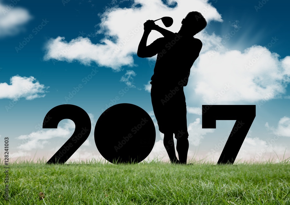 Silhouette of man playing golf forming 2017 new year sign