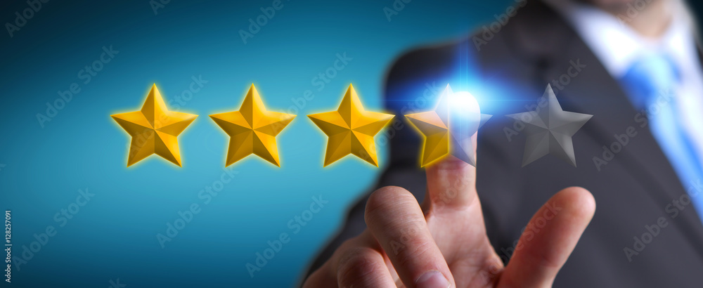 Businessman rating stars with his hand