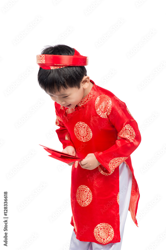 Little Vietnamese boy holding red envelops for Tet. The word mea