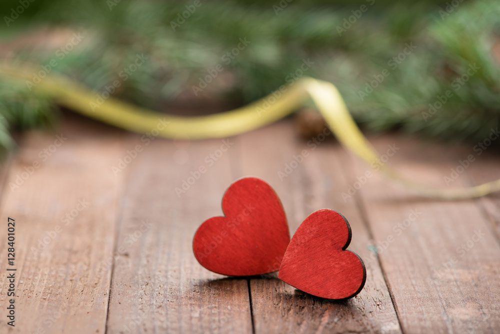 Two red wooden hearts on the table. Christmas decoration. Copy space. Valentine. Love.