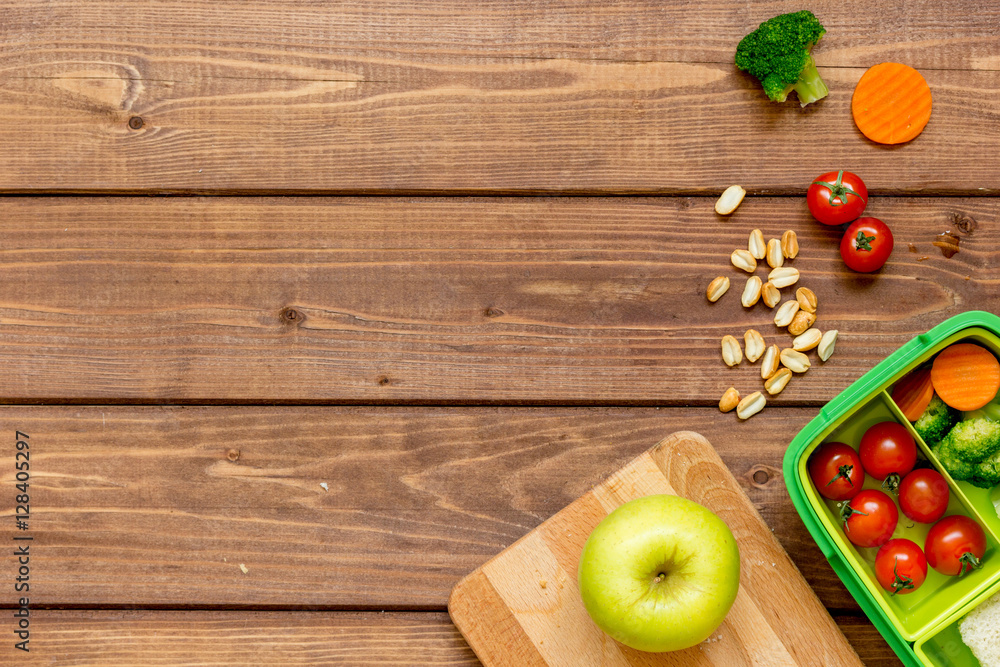 ingredients for childrens lunch on wooden background top view