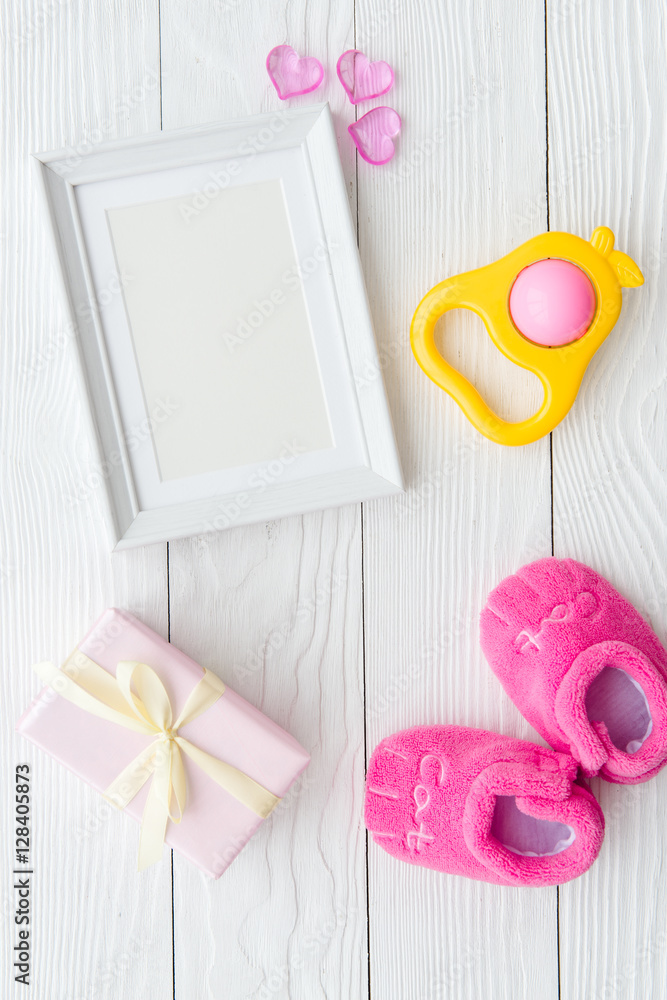 birth of child - blank picture frame on wooden background