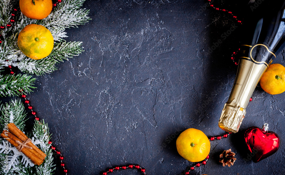 Christmas gifts and champagne with tangerines top view