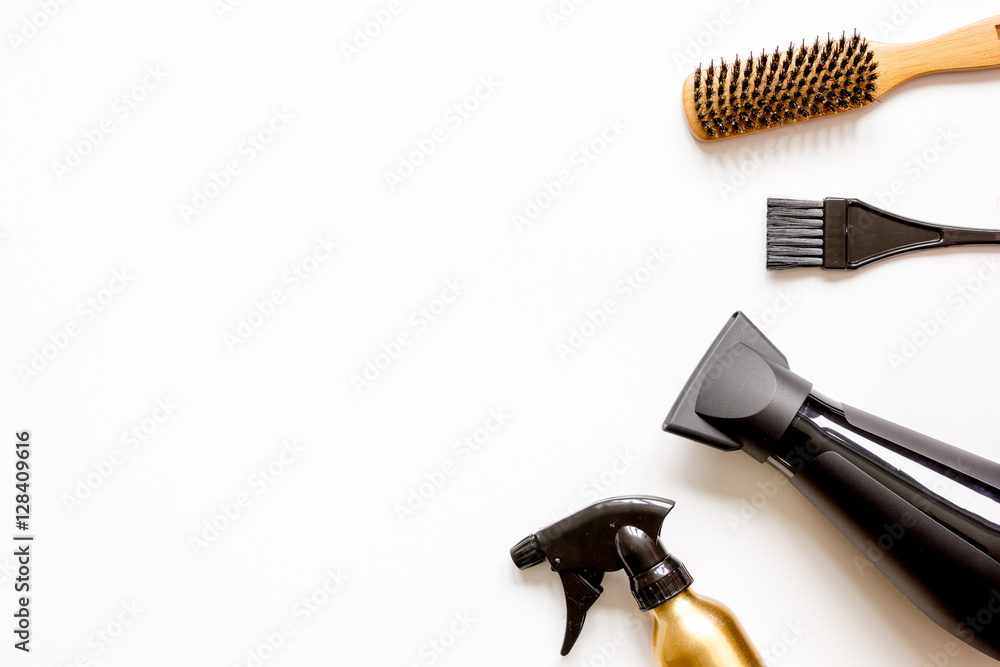 combs and hairdresser tools on white background top view