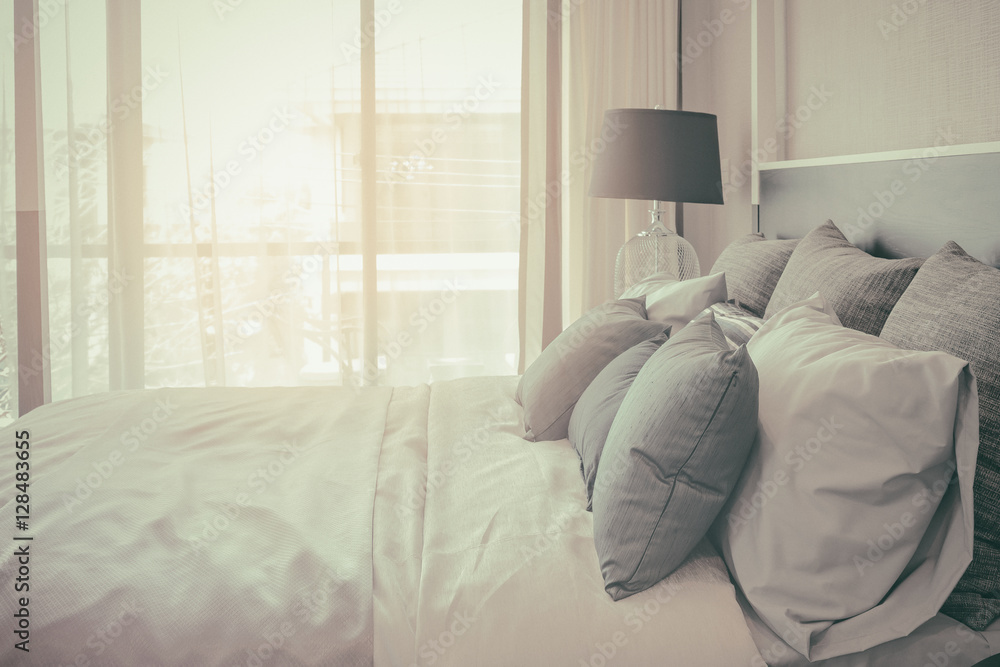 pillows on bed and luxury black lamp style on wooden table side