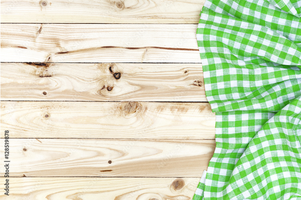 Wooden table, top view, green checkered tablecloth