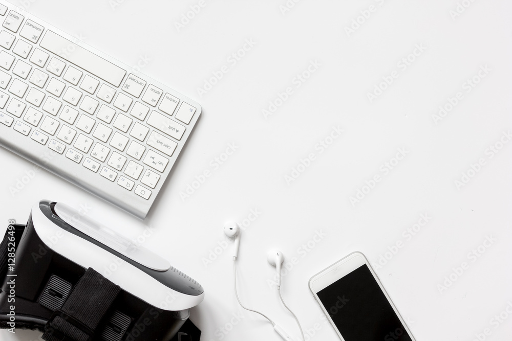 virtual reality glasses with smartphone, keyboard on white background