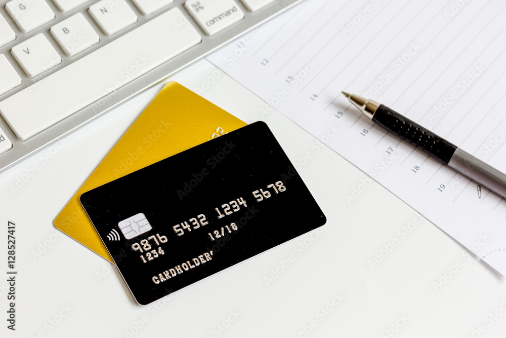 Credit cards with keyboard close up on white background