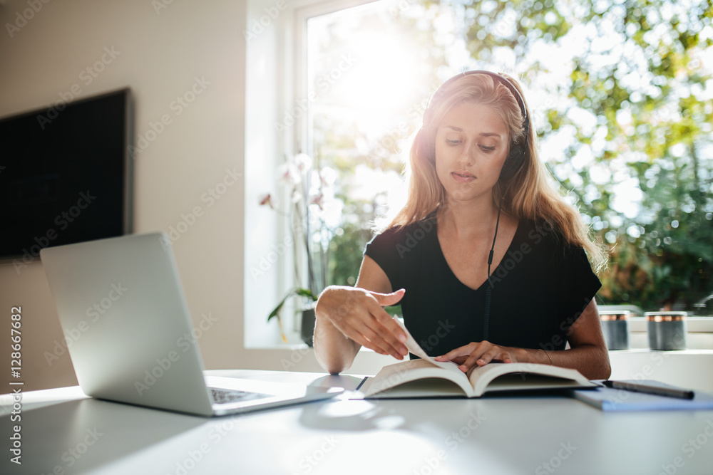 Young woman studying at home