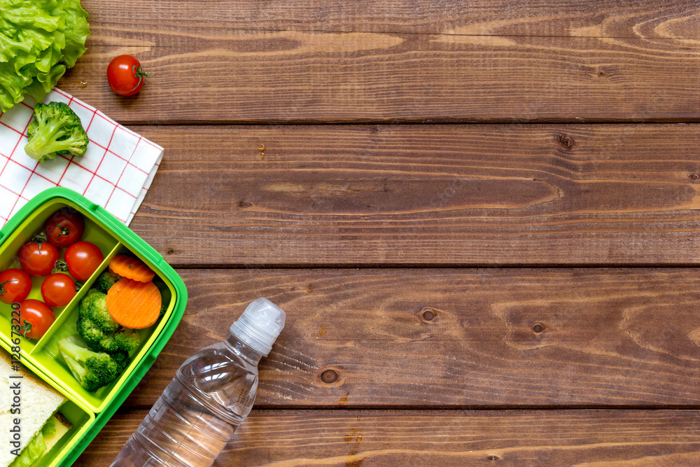 preparing lunch for child school top view on wooden background