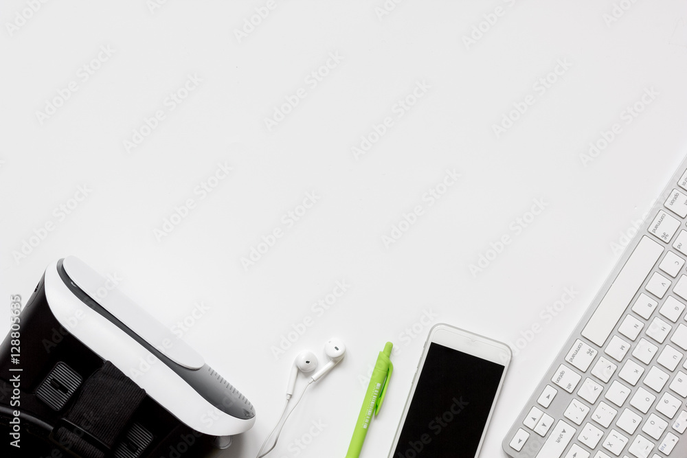 virtual reality glasses with smartphone, keyboard on white background