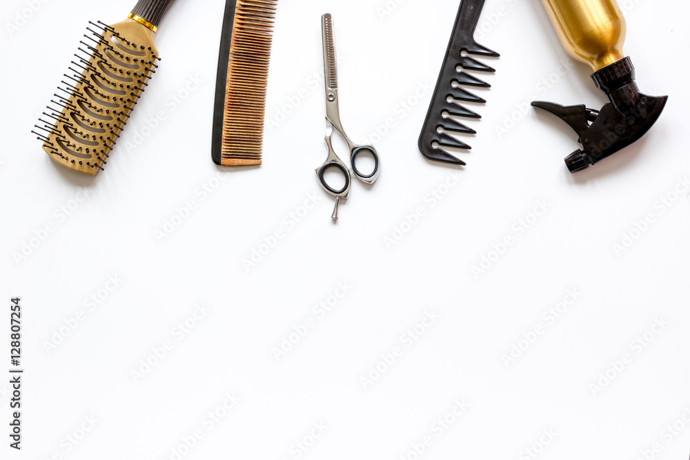 combs and hairdresser tools on white background top view