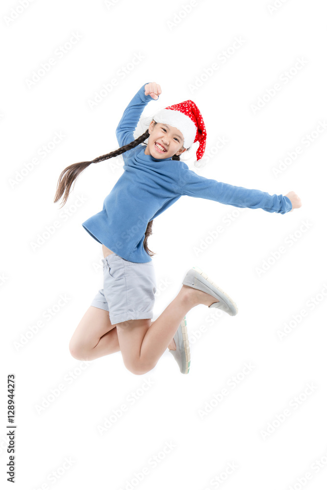 Happy Asian child girl with santa hat jumping isolated on white