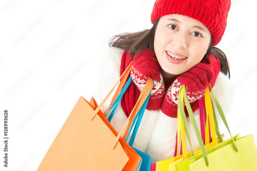 cute woman holding colorful shopping bags