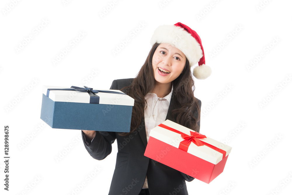 Christmas woman holding gifts wearing Santa hat