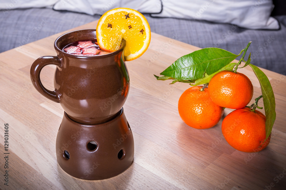 Ginger and herbs tea with slice of orange