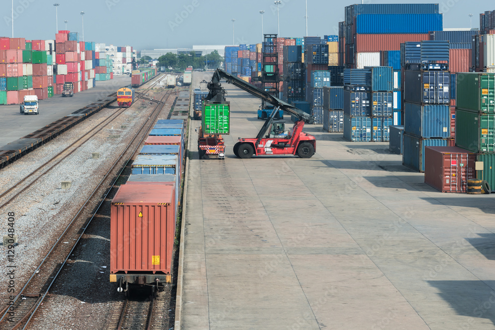 Cargo train platform with freight train container at depot in po