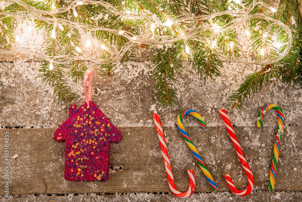 christmas decorations with snow on the wooden background