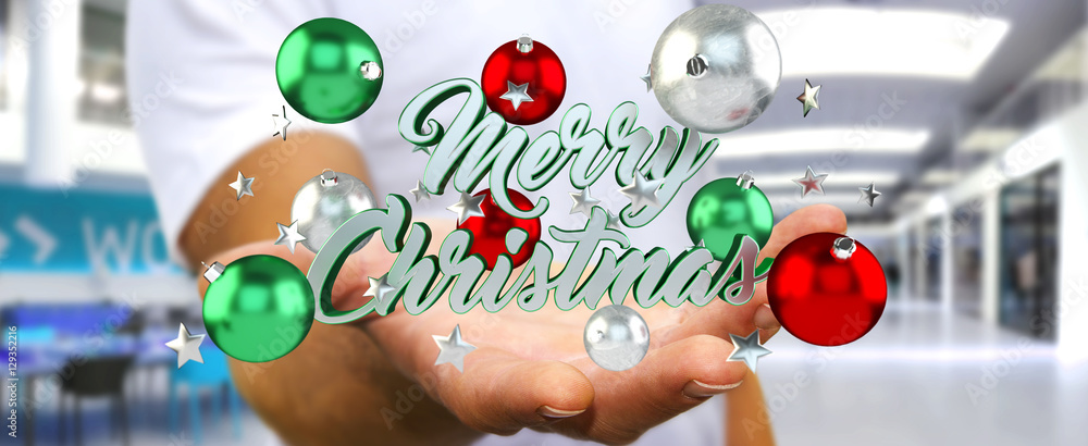 Businessman holding floating christmas message in his hand 3D re