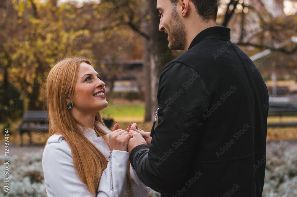 She telling something to him, both are smiling. The couple in lo