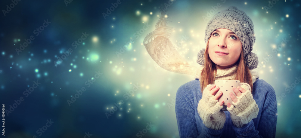 Young woman holding red coffee mug