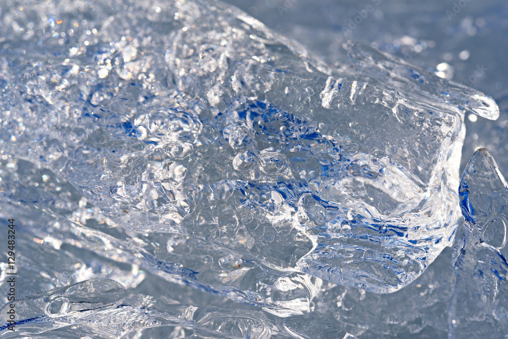 Picture of spring concealing ice floe close up with cracks and b