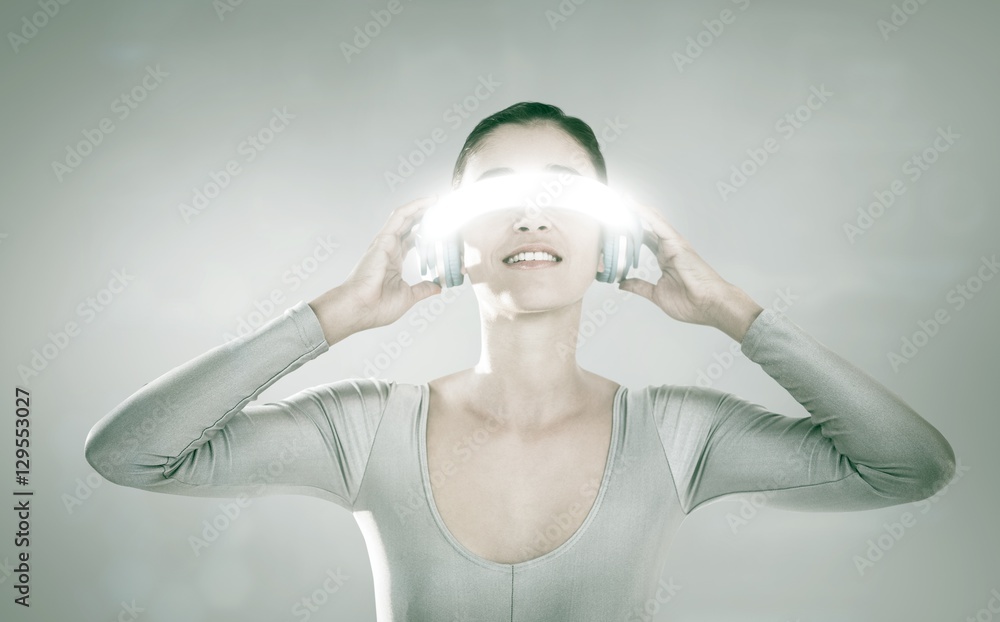 Composite image of young woman using virtual video glasses