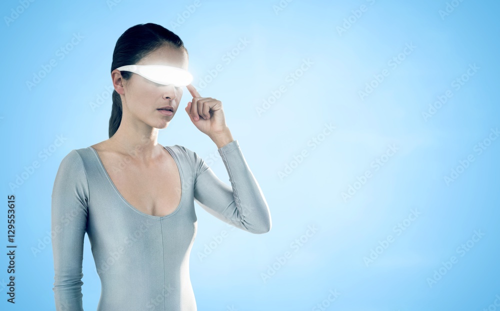 Composite image of young woman using virtual video glasses