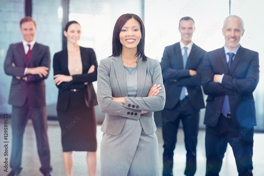 Portrait of business people standing with arms crossed