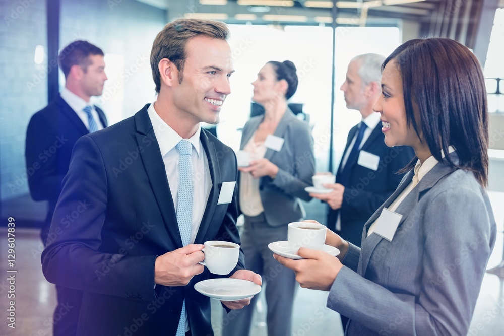 Businesspeople having a discussion during break time