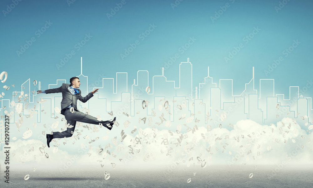 Businessman jumping high